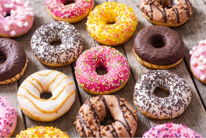 Box of glazed donuts overlaid with SAM 3.1 segmentation masks